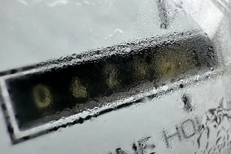 Slide: The Image of Close-up of a wet Bennington RL 210 2004 hour meter display. - 23