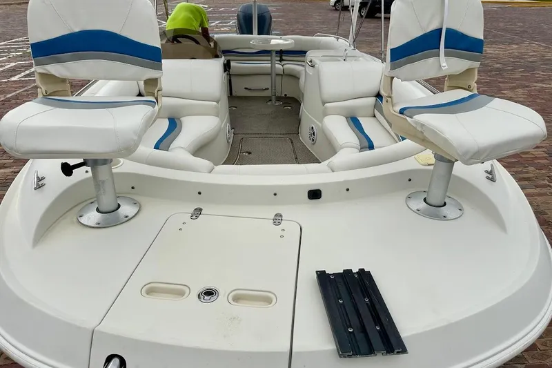 Slide: The Image of 2004 Bennington RL 210 boat interior with white and blue seating. - 7