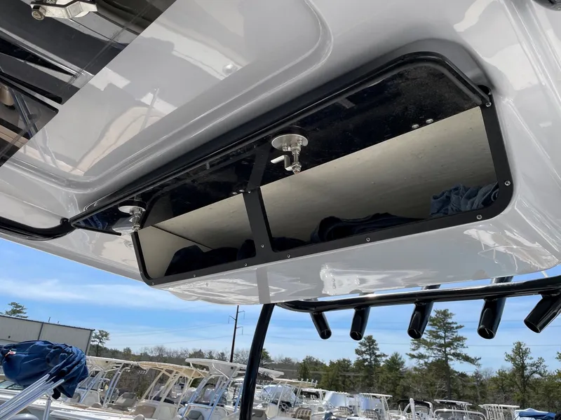 Slide: The Image of Key West 263 FS 2023, boat roof storage compartment. - 10