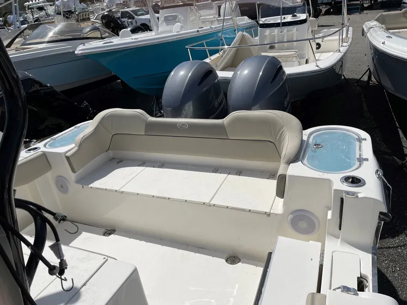 Slide: The Image of Key West 263 FS 2023 boat with dual engines at dock. - 13