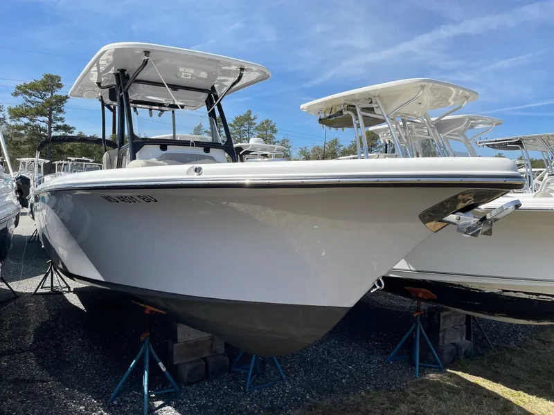 Slide: The Image of 2023 Key West 263 FS boat on stands outdoors. - 2