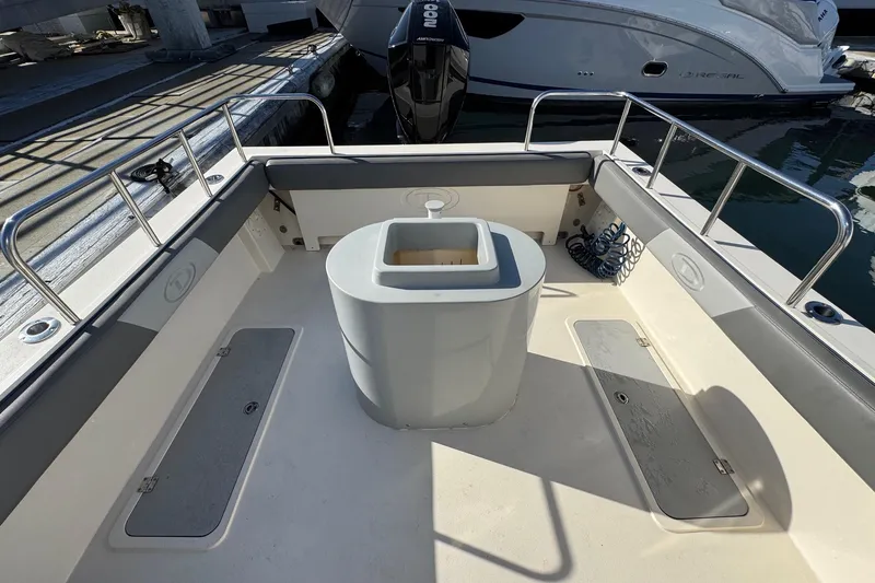 Slide: The Image of 2023 Defiance Admiral 220 EX boat interior with seating and storage compartments. - 20