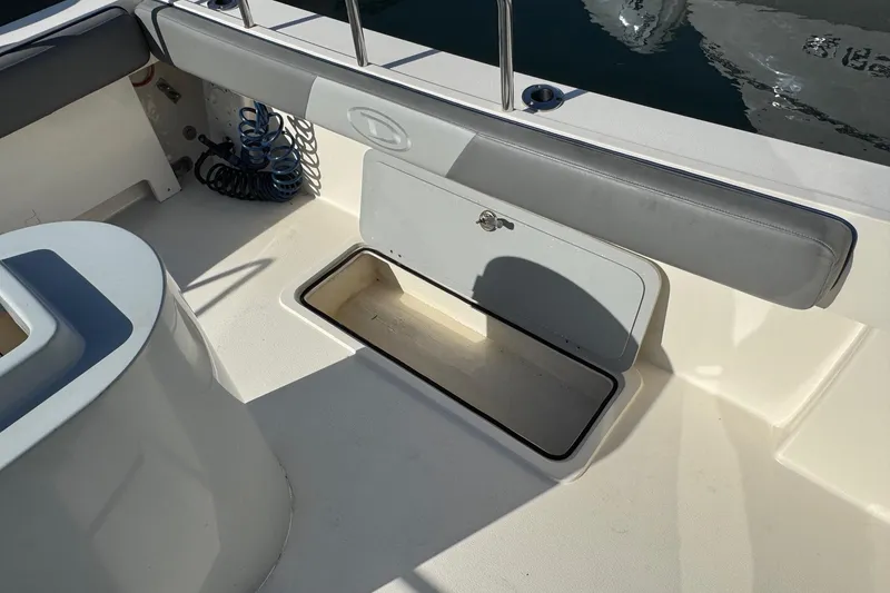 Slide: The Image of 2023 Defiance Admiral 220 EX boat interior with open storage compartment. - 25