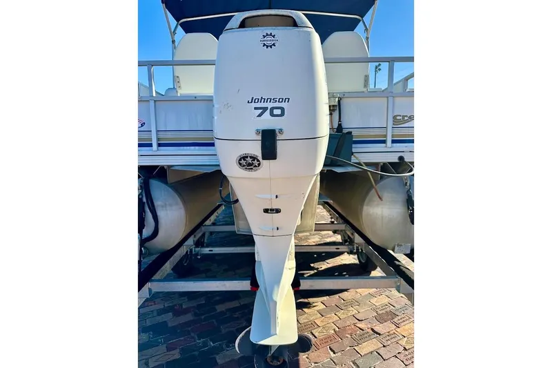 Slide: The Image of 2004 Crest 2200 Family DL with Johnson 70 outboard motor on trailer. - 10