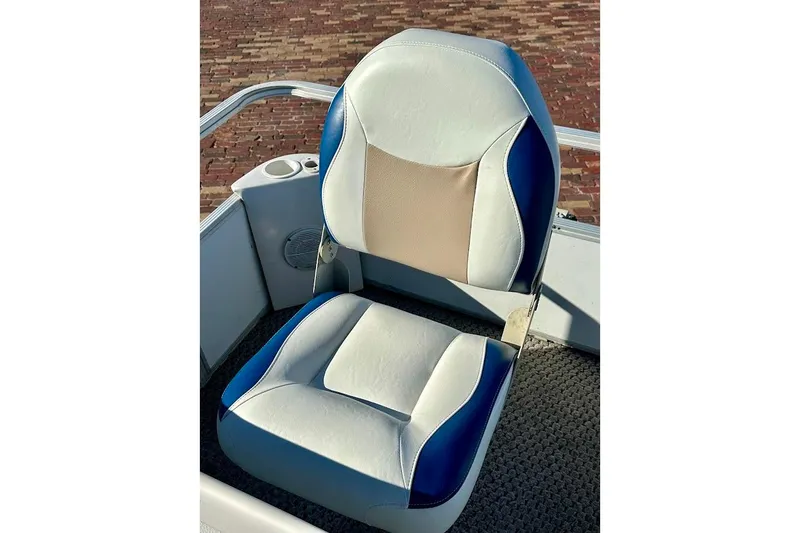 Slide: The Image of Boat seat on 2004 Crest 2200 Family DL, featuring blue and beige upholstery. - 27