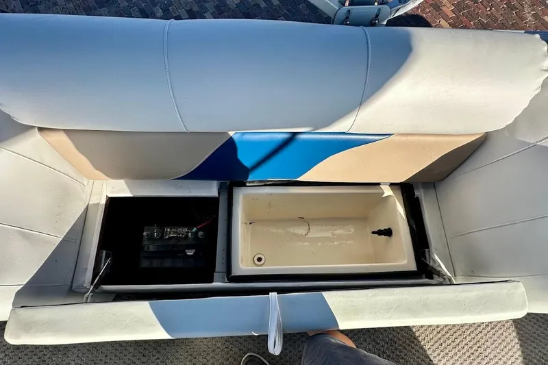 Slide: The Image of 2004 Crest 2200 Family DL boat seat storage with battery and compartment. - 31