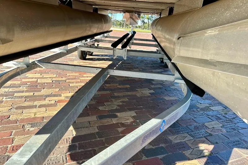 Slide: The Image of Underneath view of a 2004 Crest 2200 Family DL pontoon boat on a trailer. - 6