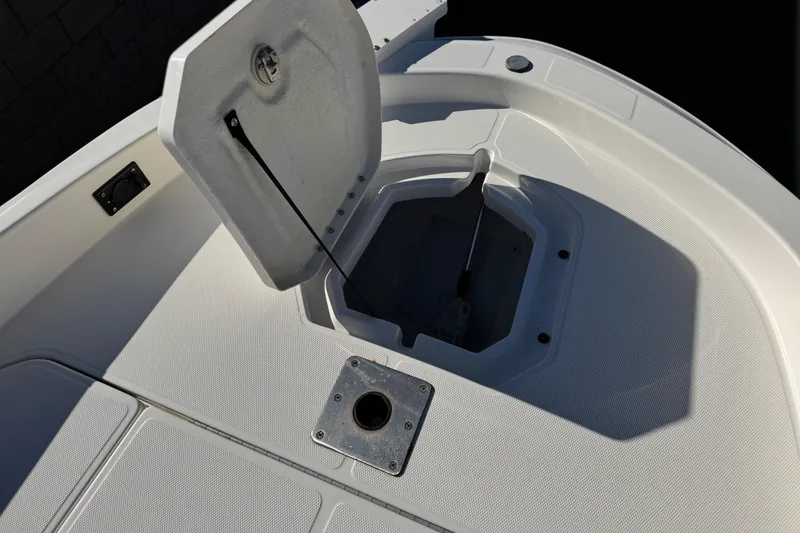 Slide: The Image of 2021 Trophy T21 Bay boat deck with open storage compartment. - 11