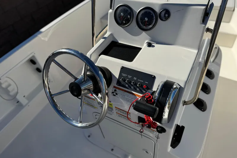 Slide: The Image of Steering console of a 2021 Trophy T21 Bay boat with gauges and controls. - 20