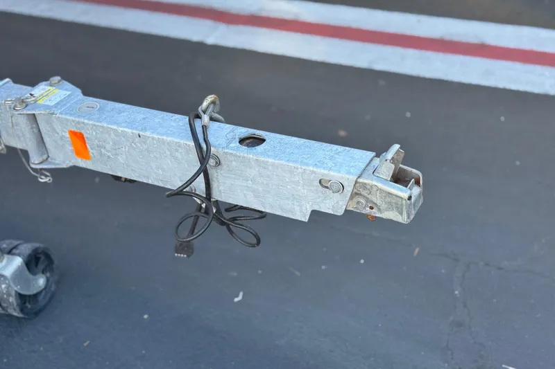 Slide: The Image of Trailer hitch of a 2021 Trophy T21 Bay on asphalt background. - 23