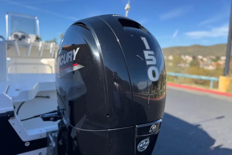 Slide: The Image of Mercury 150 outboard motor on 2021 Trophy T21 Bay boat, sunny day. - 7