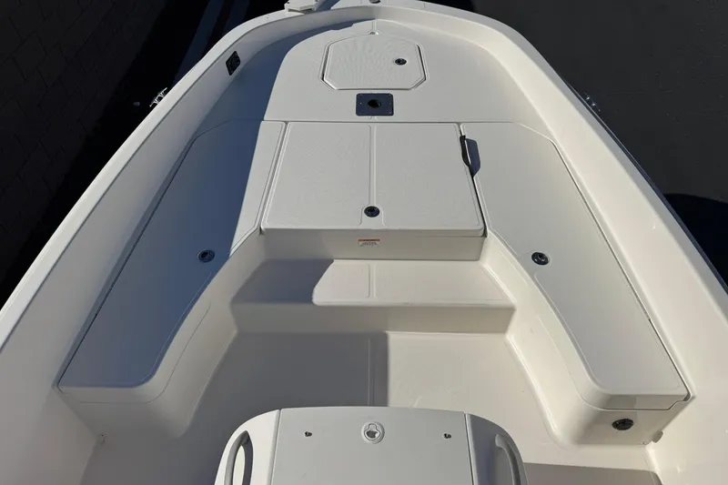 Slide: The Image of 2021 Trophy T21 Bay boat deck, featuring spacious seating and storage compartments. - 9