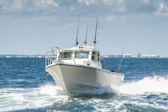 Slide: The Image of Manufacturer Provided Image: 2022 Parker 2320 Sport Cabin boat cruising on the ocean. - 28