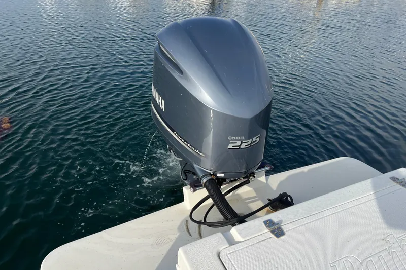 Slide: The Image of Yamaha 225 outboard motor on 2022 Parker 2320 Sport Cabin boat in water. - 3