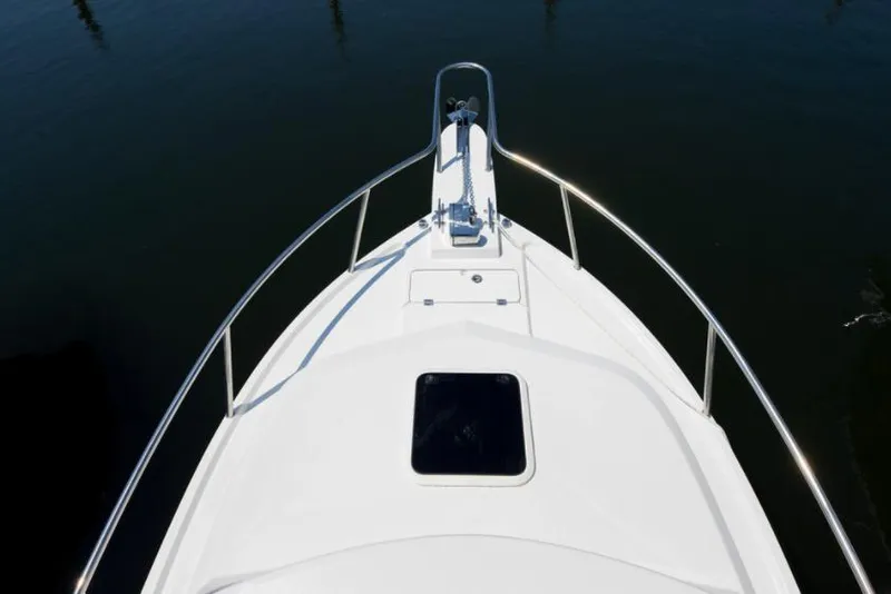 Slide: The Image of Manufacturer Provided Image: Bow of 2022 Parker 2320 Sport Cabin boat with anchor and hatch. - 31