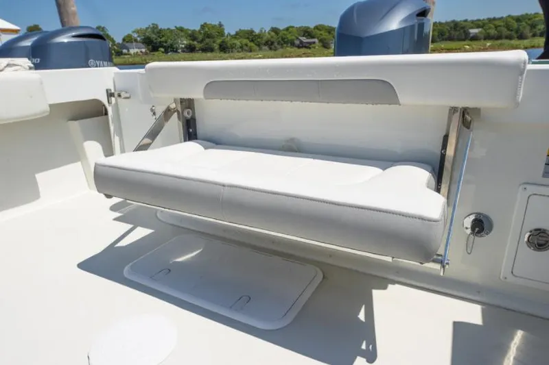 Slide: The Image of Manufacturer Provided Image: 2022 Parker 2320 Sport Cabin fold-down bench seat in the boat's cockpit. - 35