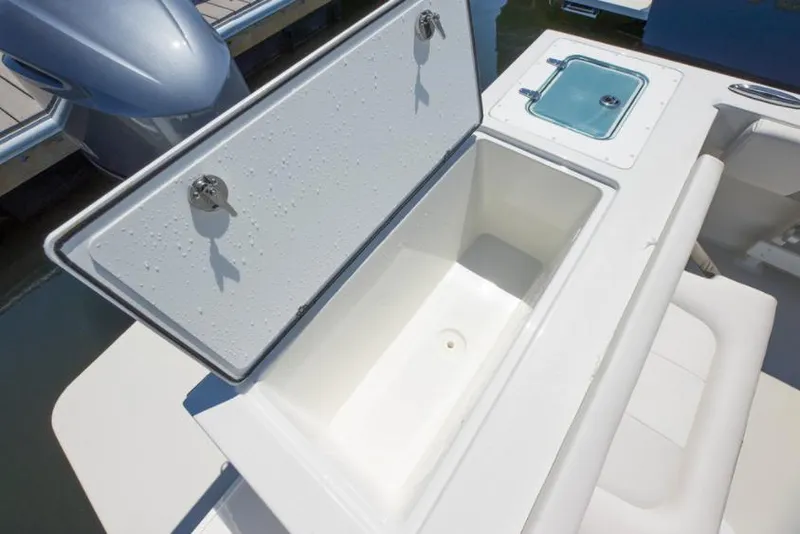 Slide: The Image of Manufacturer Provided Image: Open storage compartment on a 2022 Parker 2320 Sport Cabin boat. - 36