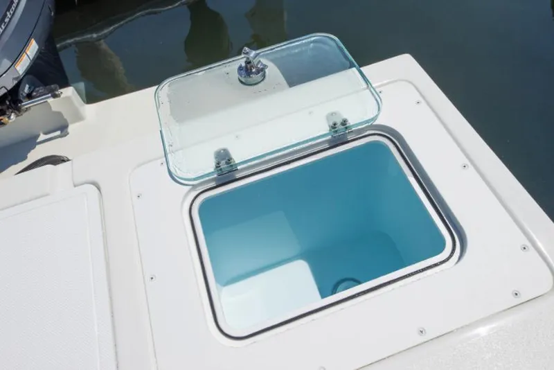 Slide: The Image of Manufacturer Provided Image: Open storage compartment on a 2022 Parker 2320 Sport Cabin boat. - 37