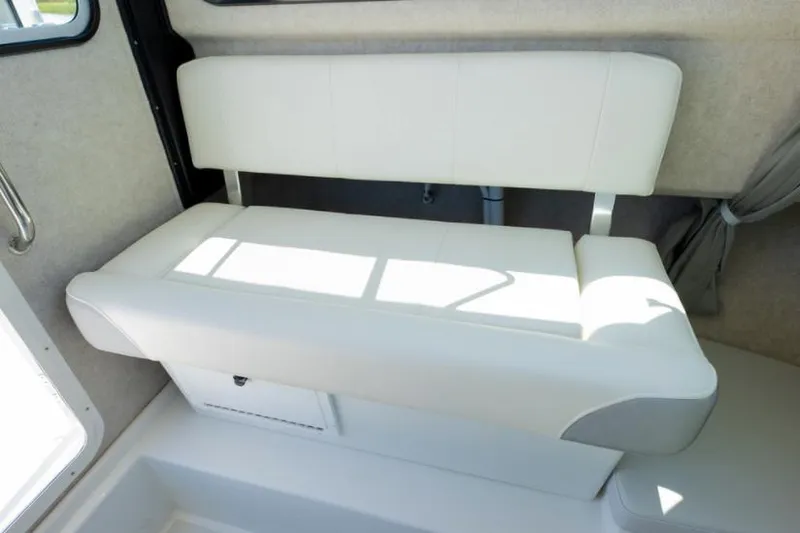 Slide: The Image of Manufacturer Provided Image: Interior seating of 2022 Parker 2320 Sport Cabin boat with white upholstery. - 39