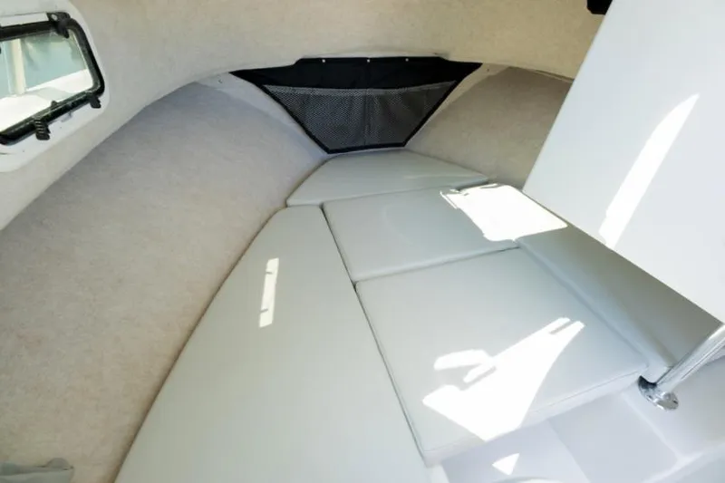 Slide: The Image of Manufacturer Provided Image: 2022 Parker 2320 Sport Cabin interior with cushioned sleeping area. - 40