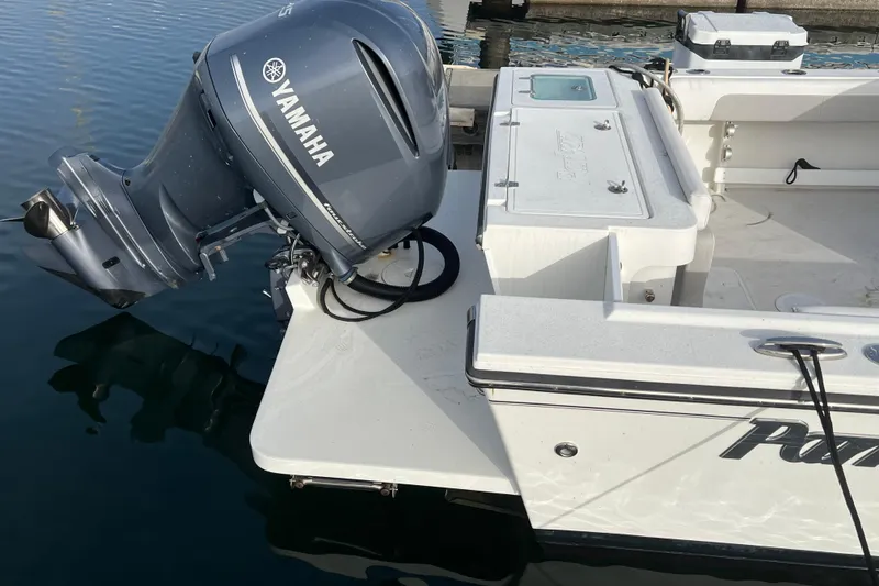 Slide: The Image of 2022 Parker 2320 Sport Cabin with Yamaha outboard engine at dock. - 5