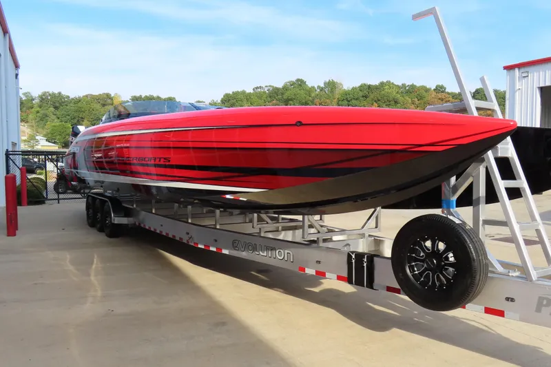 Slide: The Image of 2025 Performance Powerboats P420 in vibrant red on a trailer, outdoors. - 3
