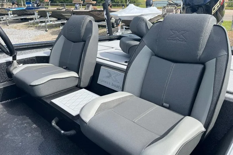 Slide: The Image of 2026 Xpress H20 Bass boat interior with gray seating and modern design. - 4