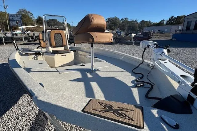 Slide: The Image of 2026 Xpress H22B Bay boat with tan seats and modern design. - 4