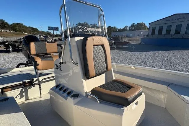 Slide: The Image of 2026 Xpress H22B Bay boat interior with cushioned seating and console. - 5
