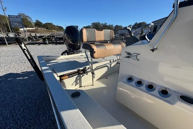 Slide: The Image of 2026 Xpress H22B Bay boat with seating and motor, displayed outdoors. - 8