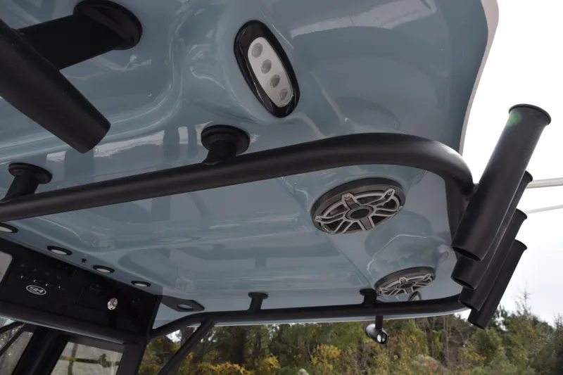 Slide: The Image of 2026 Sea Hunt Ultra 255 SE boat interior ceiling with speakers and rod holders. - 11