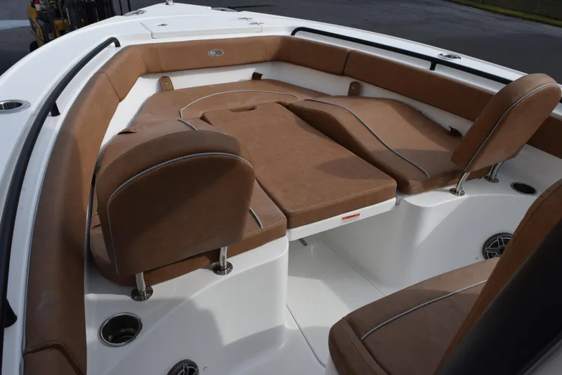 Slide: The Image of Luxurious seating on 2026 Sea Hunt Ultra 255 SE boat, featuring brown cushions. - 13