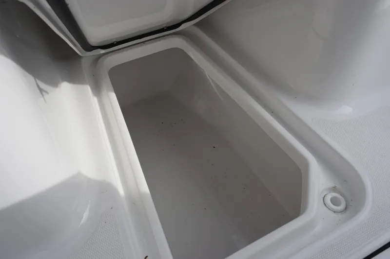 Slide: The Image of Storage compartment of 2026 Sea Hunt Ultra 255 SE boat, open and empty. - 18
