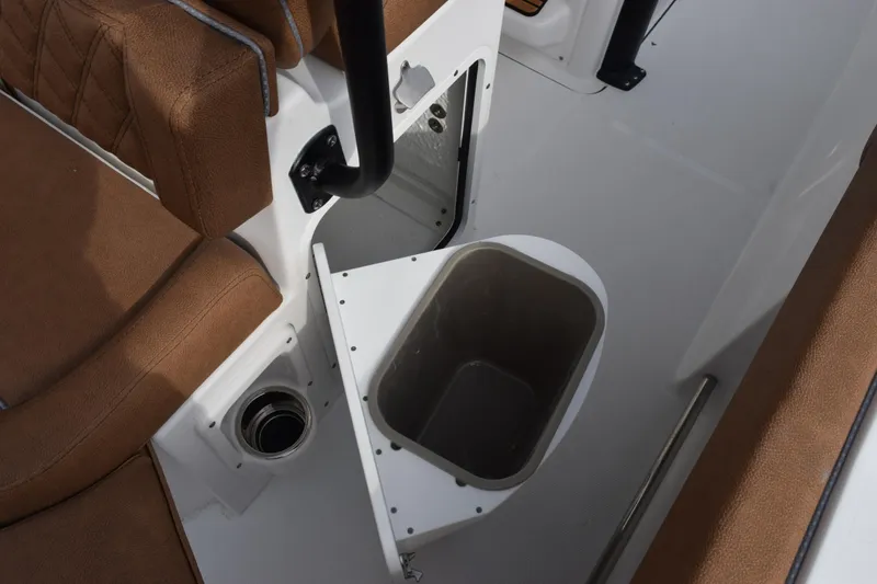 Slide: The Image of 2026 Sea Hunt Ultra 255 SE boat interior with open storage compartment. - 21