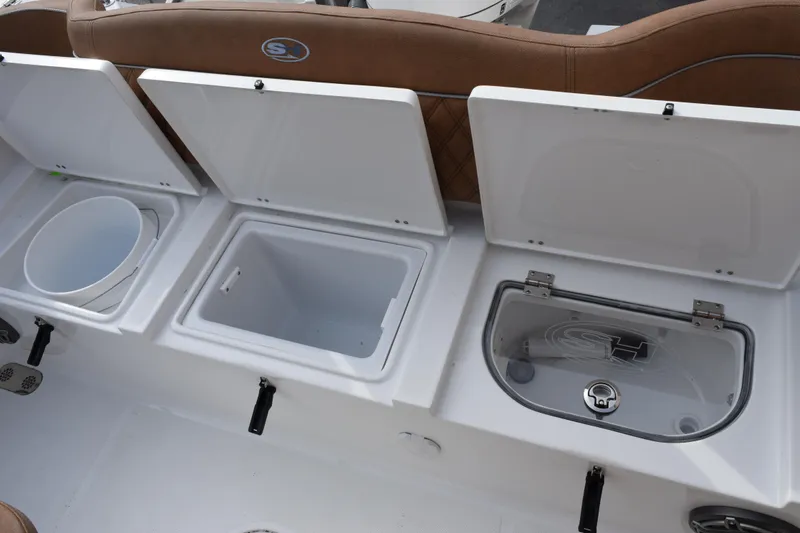 Slide: The Image of 2026 Sea Hunt Ultra 255 SE boat storage compartments and seating detail. - 24