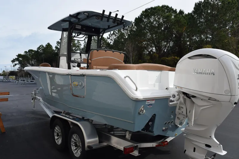 Slide: The Image of 2026 Sea Hunt Ultra 255 SE boat with Yamaha engine on trailer. - 5