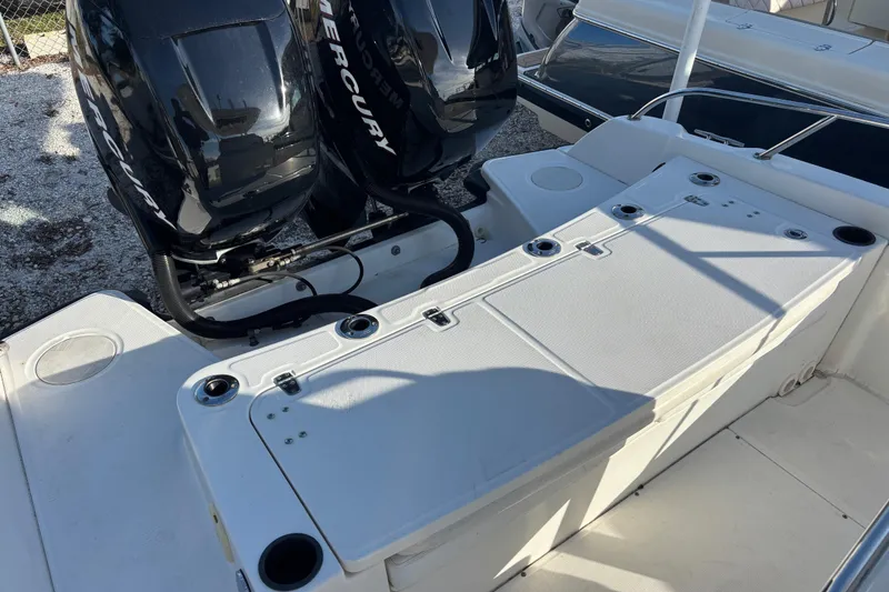 Slide: The Image of 2015 Boston Whaler 270 Dauntless boat with dual Mercury engines, rear deck view. - 13