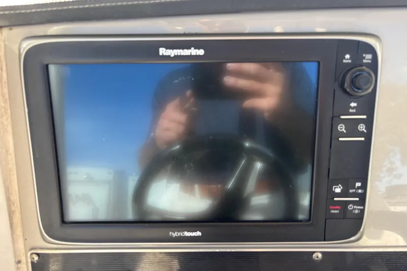 Slide: The Image of Raymarine display on 2015 Boston Whaler 270 Dauntless boat dashboard. - 14