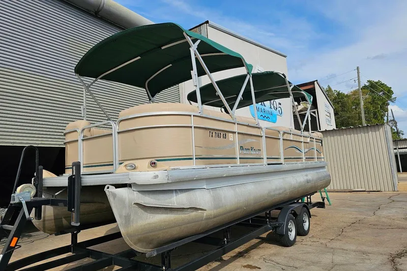 Slide: The Image of 2004 Parti Kraft Admiral 240 RE pontoon boat on trailer, green canopy, docked outdoors. - 12