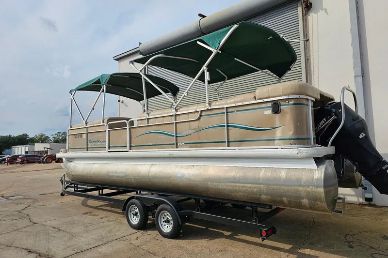 Slide: The Image of 2004 Parti Kraft Admiral 240 RE pontoon boat with green canopy on trailer. - 14