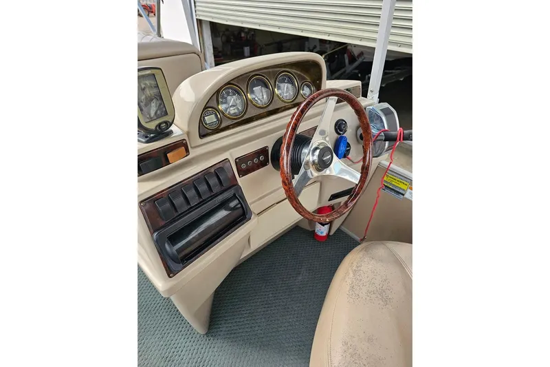 Slide: The Image of Steering console of 2004 Parti Kraft Admiral 240 RE pontoon boat. - 2