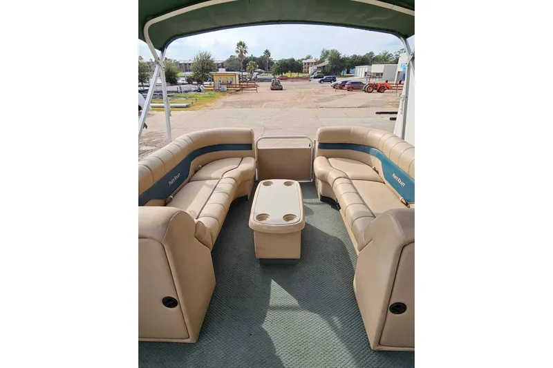 Slide: The Image of 2004 Parti Kraft Admiral 240 RE pontoon boat with beige seating and green canopy. - 5