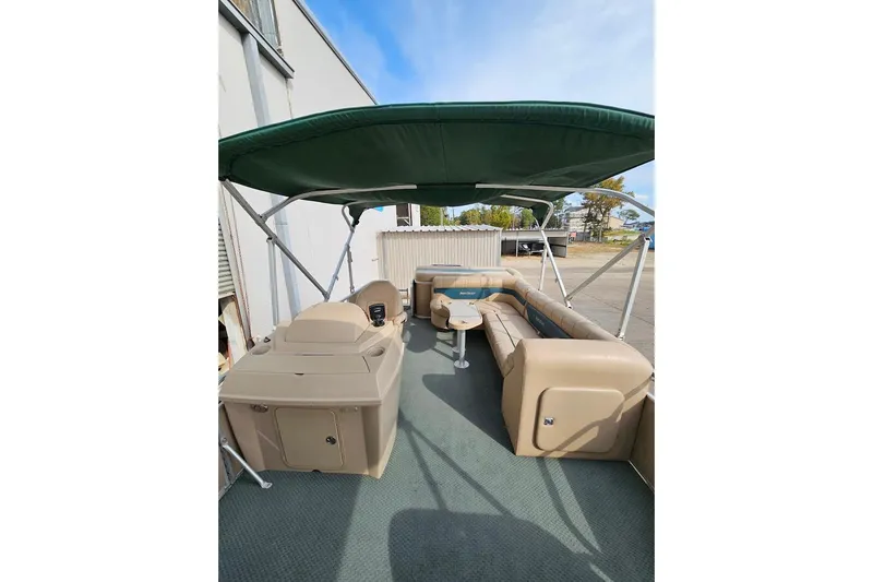 Slide: The Image of 2004 Parti Kraft Admiral 240 RE pontoon boat with canopy and seating. - 6