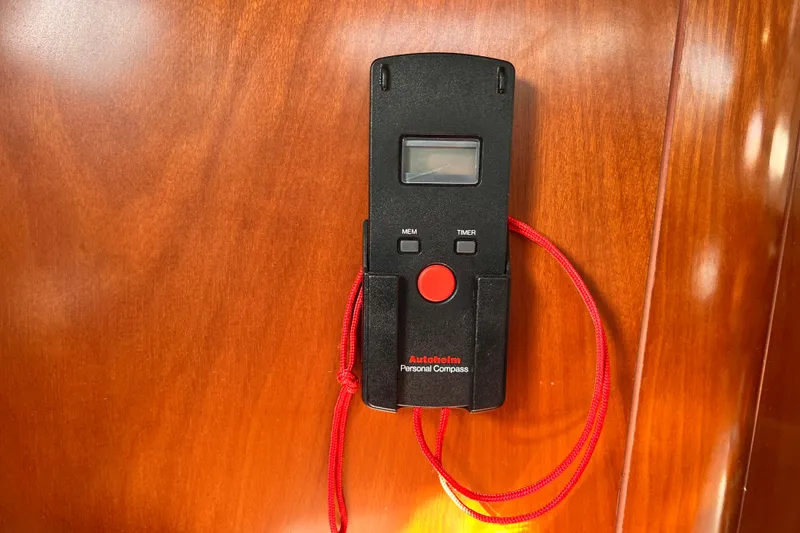 Slide: The Image of Autohlem personal compass on Beneteau 343 yacht, 2005 model, with red lanyard. - 24