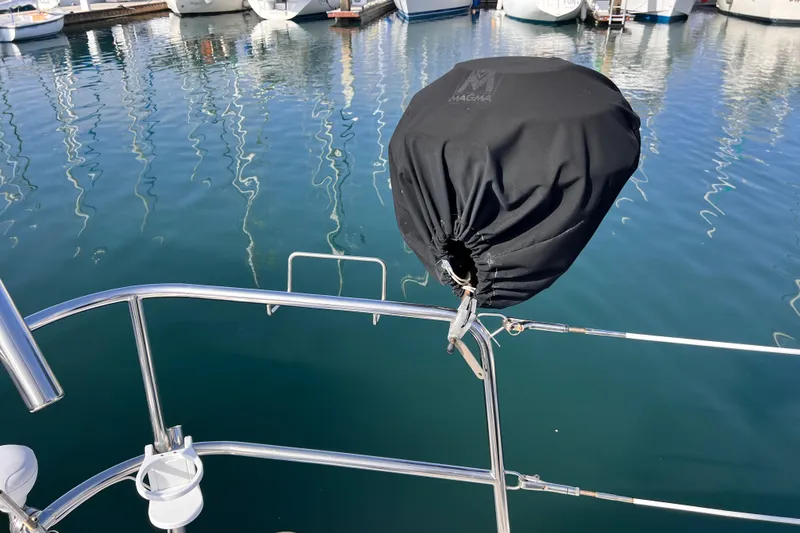 Slide: The Image of Beneteau 343 sailboat with covered grill, docked in marina, 2005 model. - 46