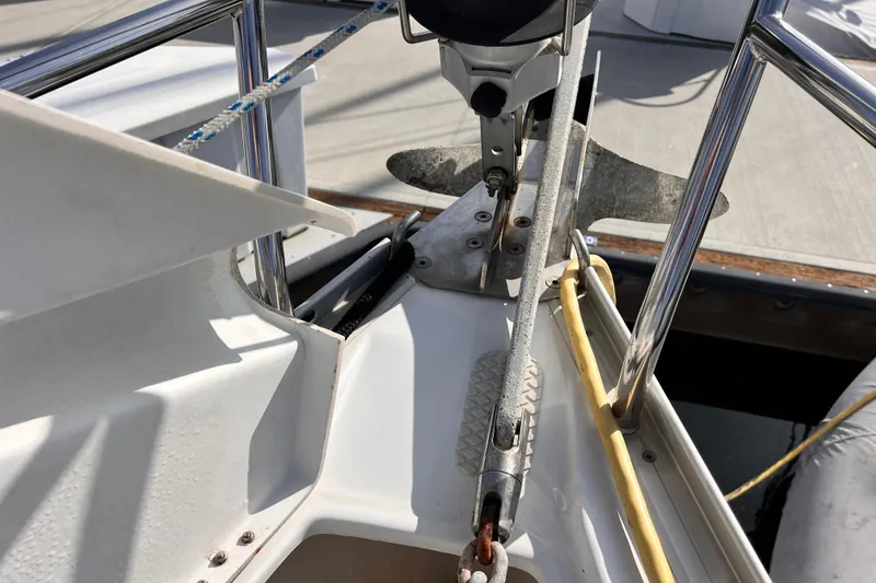 Slide: The Image of Deck view of a 2005 Beneteau 343 sailboat, featuring anchor and rigging details. - 54