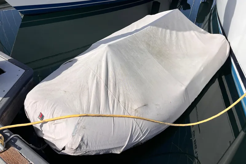 Slide: The Image of Covered 2005 Beneteau 343 sailboat docked at marina. - 59