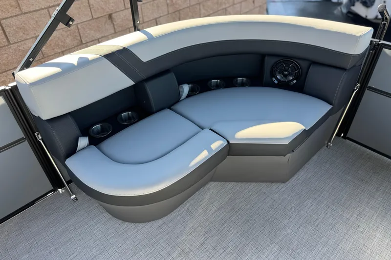 Slide: The Image of Luxurious seating area in 2026 Berkshire 22UL CTS pontoon boat with cup holders and speaker. - 11