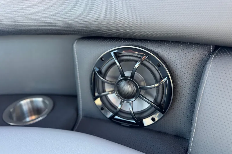 Slide: The Image of Speaker and cup holder in 2026 Berkshire 22UL CTS boat interior. - 13