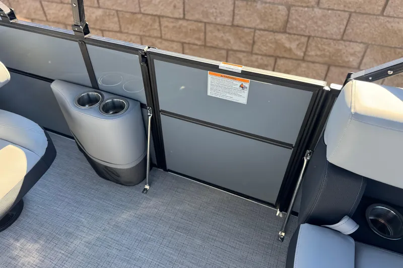 Slide: The Image of 2026 Berkshire 22UL CTS boat interior with cup holders and seating. - 14